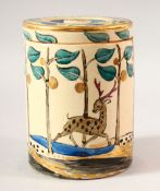 AN ISLAMIC DESIGN POTTERY JAR AND COVER, the jar painted with running deer amongst stylised