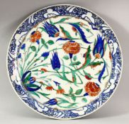 A TURKISH IZNIK POTTERY PLATE - decorated with scenes of native floral motif decorations, 33cm