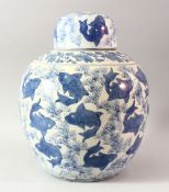 A LARGE CHINESE BLUE AND WHITE PORCELAIN JAR AND COVER, profusely decorated with fish, 37cm high