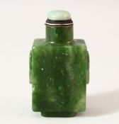 AN 18TH / 19TH CENTURY CHINESE CARVED GREEN JADE SNUFF BOTTLE, carved with twin handle and rings,