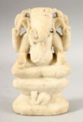 A 17TH/18TH CENTURY SOUTH INDIAN CARVED MARBLE FIGURE OF GANESH, 18cm high.