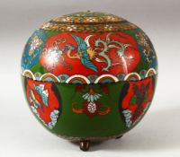 A CHINESE CLOISONNE JAR AND COVER, decorated with phoenix and floral motifs, supported on three