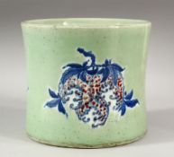 A LARGE CHINESE CELADON GLAZED BRUSH POT, the decorated with peaches, flora and forna, 17cm high,