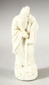 A SMALL CHINESE BLANC DE CHINE FIGURE OF A SAGE, 14.5cm high.