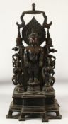 A LARGE AND IMPRESSIVE TIBETAN BRONZE FIGURAL SHRINE, 100cm high.