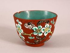 A CHINESE YIXING CLAY TEA BOWL - the exterior enameled with birds and flora - the interior with a