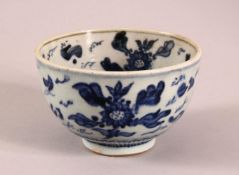 A SMALL CHINESE BLUE AND WHITE BOWL, painted with fish and flora, 12cm diameter, 7.5cm high.