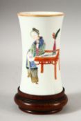 A SMALL CHINESE FAMILLE ROSE PORCELAIN BRUSH POT AND STAND, the body painted with a female figure,