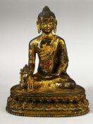 A GOOS SINO TIBETAN GILT BRONZE FIGURE OF BUDDHA / DEITY - in a seated pose holding flora, the