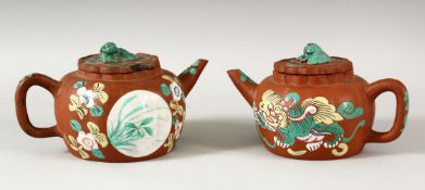 TWO CHINESE YIXING CLAY TEAPOTS WITH POLY CHROME DECORATION- the pots decorated depicting panels