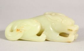 A CHINESE CARVED JADE CROUCHING LION, 9cm long.