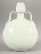 A CHINESE BLANC DE CHINE TWIN HANDLE MOONFLASK, with curving handles, 33cm high, 22cm diameter.