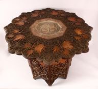 A FINE 19TH CENTURY INDIAN KASHMIRI CARVED WOODEN TABLE - the top carved in relief with leaves and