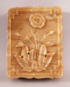 AN INDIAN ALABASTER RECTANGULAR BOX AND COVER, the lid carved with flower, 11cm x 8.5cm.