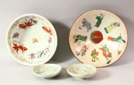 TWO CHINESE PORCELAIN BOWLS, one decorated with fish, the other with figures, (both af), together