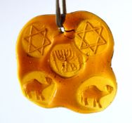 A JEWISH JUDAICA AMBER COLOUR GLASS HANGING / PENDANT - the glass impressed with related animals and