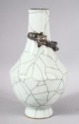 A GOOD CHINESE CRACKLE GLAZED VASE, with moulded dragon to the neck, 23cm high.