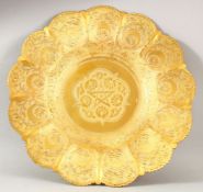 A GOOD TURKISH GILDED COPPER ENGRAVED DISH - decorated with flora and symbols, 34cm