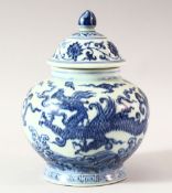 A CHINESE BLUE AND WHITE PORCELAIN GINGER JAR AND COVER, decorated with dragon and lotus, overall