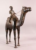 A LARGE INDIAN WHITE METAL MODEL OF A CAMEL AND RIDER, 46cm high, 46cm long.