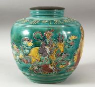 A CHINESE TURQUOISE GLAZED FAHUA STYLE VASE, the body decorated with a sage with another figure