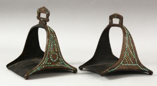 A MATCHED PAIR OF 18TH/19TH CENTURY PERSIAN OR OTTOMAN STEEL STIRRUPS, inset with turquoise beads.
