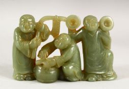 A CHINESE CARVED JADITE GROUP OF THREE MUSICIANS, 12.5cm wide.
