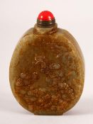 A CHINESE CARVED JADE SNUFF BOTTLE - carved with boys and funghi the verso with calligraphy, 8cm