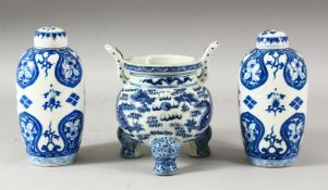 A CHINESE BLUE AND WHITE PORCELAIN TRIPOD CENSER, decorated with two dragons and the flaming pearl