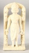 AN 18TH CENTURY INDIAN CARVED MARBLE FIGURE OF A MUTLI ARM DEITY, standing beneath an archway, 29.