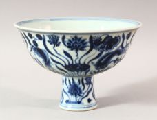 A CHINESE BLUE AND WHITE PORCELAIN STEM CUP, decorated with fish amongst aquatic flora, bowl 17cm