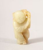 A SMALL CHINESE CARVED JADE FIGURE OF A BOY, possibly Ming Dynasty, 5.5cm high.