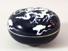 A CHINESE BLUE GLAZED PORCELAIN DRAGON BOX AND COVER, 13.5cm diameter.