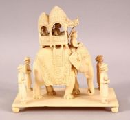 A FINE 19TH CENTURY INDIAN CARVED IVORY ELEPHANT GROUP, the elephant with covered howdah