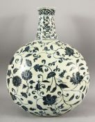 A MING STYLE BLUE AND WHITE MOONFLASK, decorated with peony and lotus flower, 45cm high, 35cm wide.