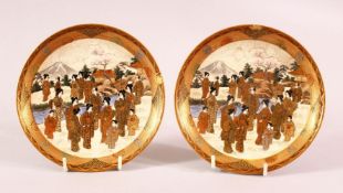 A PAIR OF JAPANESE MEIJI PERIOD SATSUMA DISHES - each decorated with scenes of beijin in landscape