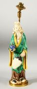 A CHINESE FAMILLE VERTE GLAZED POTTERY FIGURAL LAMP, overall 42cm high.