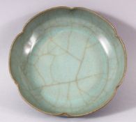 A CHINESE CRACKLE GLAZE CELADON BOWL, the base with circular calligraphic script, 16cm diameter.