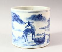 A LARGE CHINESE BLUE AND WHITE BRUSH POT, decorated with deer in a landscape setting, six
