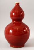 A CHINESE RED GLAZED DOUBLE GOURD VASE, six character mark to base, 33.5cm high.