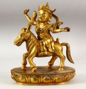 A CHINESE GILT BRONZE FIGURE OF A MAN RIDING AN ASS on a lotus form base, 22cm high.