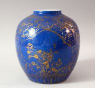 A CHINESE BLUE GROUND AND GILT DECORATED JAR, the body painted with panels of flowers, floral motifs