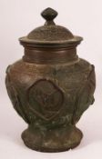 A 19TH / 20TH CENTURY CHINESE BRONZE VASE & COVER, with panels of birds and animals, the base with