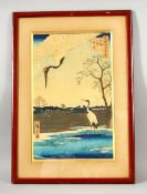 A JAPANESE WOODBLOCK PRINT, after Hiroshige, depicting cranes in a landscape setting with a pond,