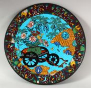 A CHINESE BLUE GROUND CLOISONNE DISH, depicting a cart with flowers, 31cm diameter.