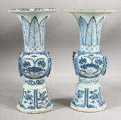 A PAIR OF CHINESE PORCELAIN GU SHAPED VASES, 31cm high.