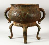 A LARGE CHINESE ARCHAIC STYLE BRONZE TWIN HANDLE CENSER, supported on four feet, the bowl with
