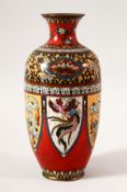 A JAPANESE MEIJI CLOISONNE VASE, with panels of stylised dragons and phoenix, 18cm high.