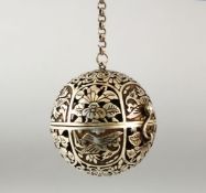 A CHINESE WHITE METAL / POSSIBLY SILVER SPHERICAL TRAVELLING INCENSE BURNER on chain, 5cm.