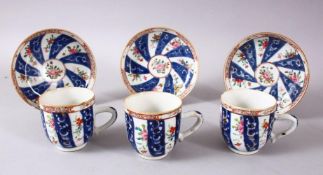 A SET OF 3 19TH CENTURY CHINESE FAMILLE ROSE CUP & SAUCERS, with bands of floral decoration, cups